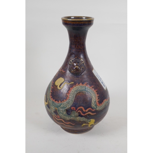 245 - A Chinese polychrome porcelain pear shaped vase with two lion mask handles and incised dragon decora... 