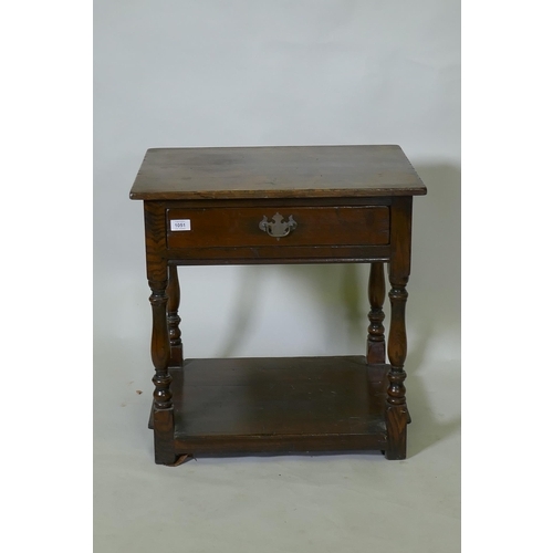 1051 - Antique style oak two tier single drawer side table, raised on baluster shaped supports, 48 x 60 x 6... 