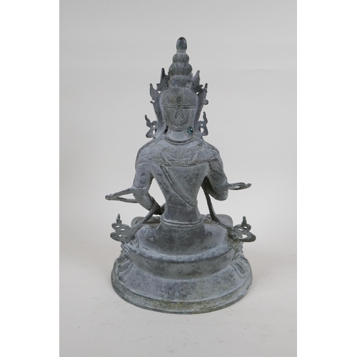 252 - A Sino Tibetan bronze figure of Buddha, with ver de gris patina, 33cm