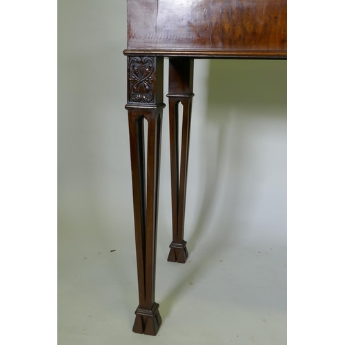 1038 - A mahogany Chippendale style serving table, with marble top and blind frieze, raised on pierced tape... 