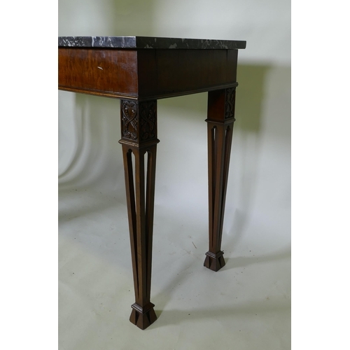 1038 - A mahogany Chippendale style serving table, with marble top and blind frieze, raised on pierced tape... 