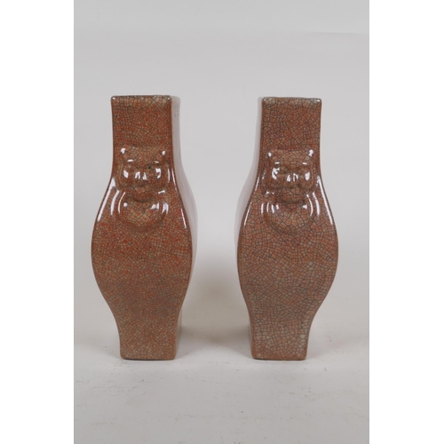 257 - A pair of Chinese crackle ware vases with kylin mask handles, seal mark to base, 22cm high