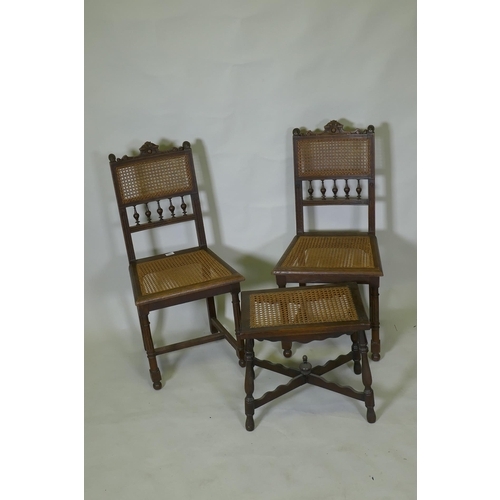 1036 - A pair of C19th French oak side chairs with cane seats and backs, and a stool