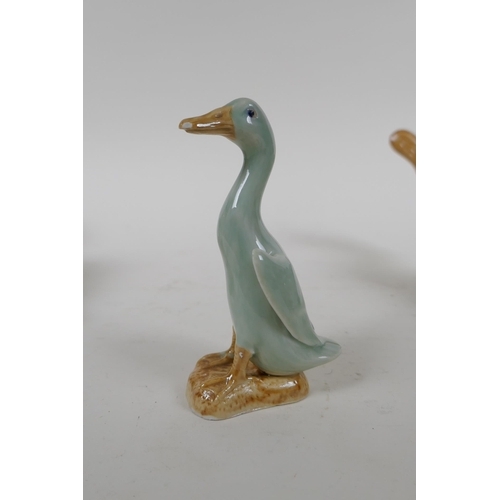 261 - A pair of Chinese celadon glazed porcelain ducks with impressed seal mark to base, and another small... 