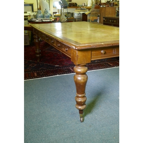 1005 - A large C19th eight drawer mahogany partners library table/desk, with leather inset top, raised on t... 