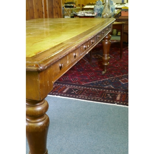 1005 - A large C19th eight drawer mahogany partners library table/desk, with leather inset top, raised on t... 