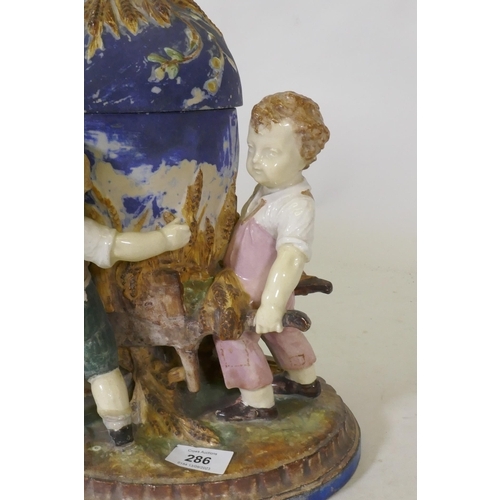 286 - C19th Majolica ceramic centrepiece in the form of three boys with a wheelbarrow, AF, 36cm high