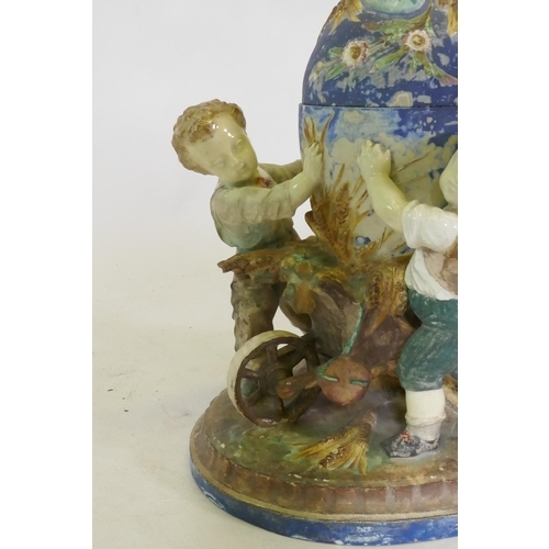 286 - C19th Majolica ceramic centrepiece in the form of three boys with a wheelbarrow, AF, 36cm high