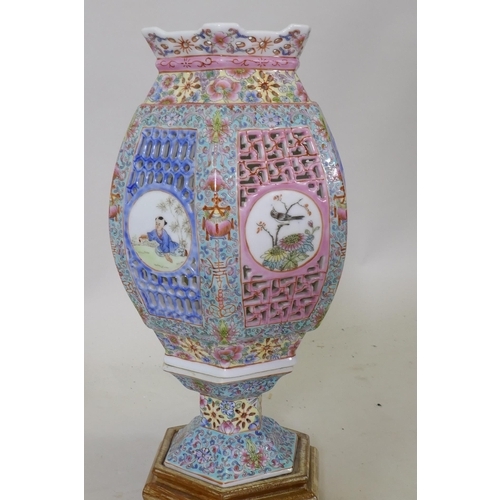 299 - A vintage Chinese porcelain lamp with pierced sleeve and polychrome decoration, and a jar and cover