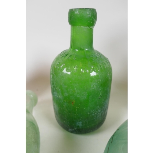 309 - A quantity of vintage glass bottles, stone ware pots and marbles, largest 23cm