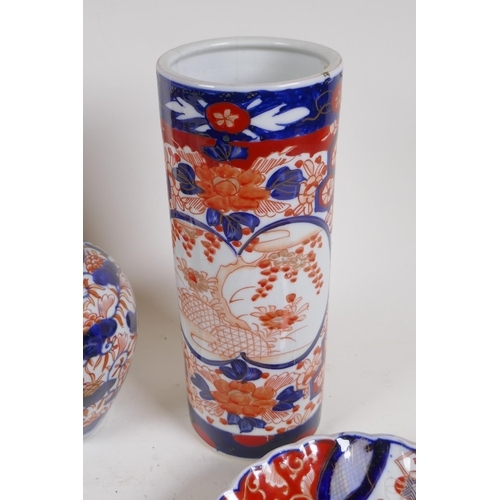 331 - A quantity of Japanese Imari porcelain, to include a cylinder vase, ribbed jar and cover, vase, fan ... 