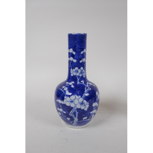 335 - A C19th Chinese blue and white bottle vase decorated with prunus blossom on a cracked ice ground, Ka... 