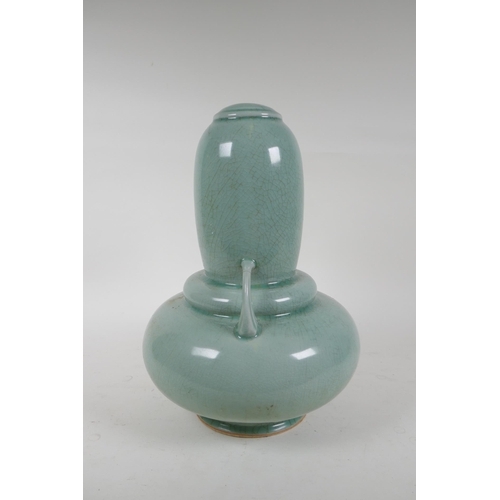 337 - An oriental celadon crackle glazed porcelain gourd with two handles, 34cm high, hairline cracks