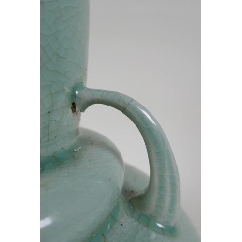 337 - An oriental celadon crackle glazed porcelain gourd with two handles, 34cm high, hairline cracks