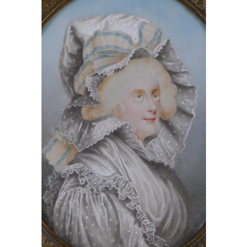 809 - An early C19th miniature watercolour portrait of a lady in a rose metal pendant frame, with plaited ... 