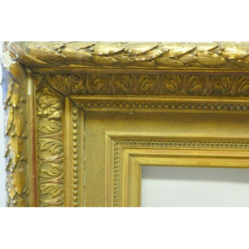 862 - A large mid Victorian giltwood and composition picture frame, with acanthus and bead decoration, reb... 