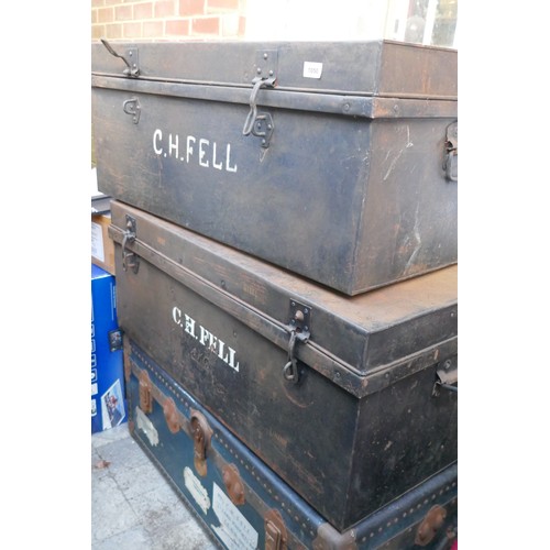 1050 - A vintage metal strapped travel trunk and two tin trunks of a similar size, 92 x 54cm, 36cm high