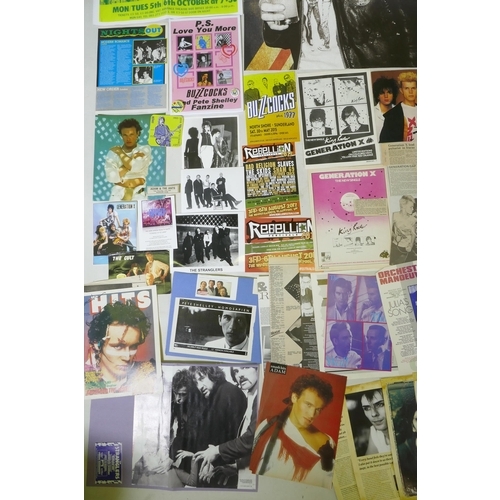 239 - A quantity of punk ephemera to include press photos, flyers, zines, badges etc, including Buzzcocks,... 