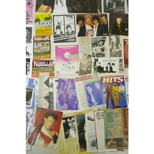 239 - A quantity of punk ephemera to include press photos, flyers, zines, badges etc, including Buzzcocks,... 