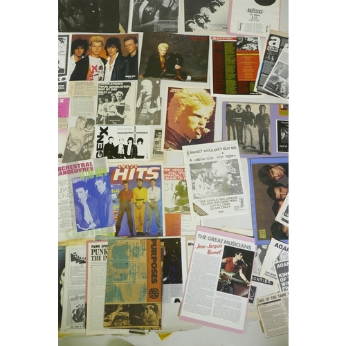 239 - A quantity of punk ephemera to include press photos, flyers, zines, badges etc, including Buzzcocks,... 