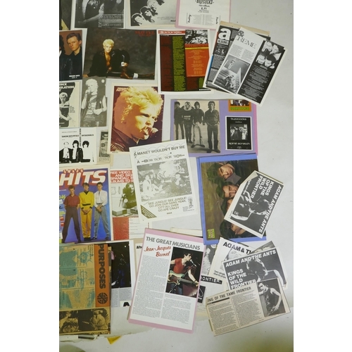 239 - A quantity of punk ephemera to include press photos, flyers, zines, badges etc, including Buzzcocks,... 