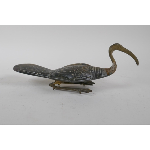 306 - An oriental carved soapstone Ibis, with metal legs, 27cm long, AF