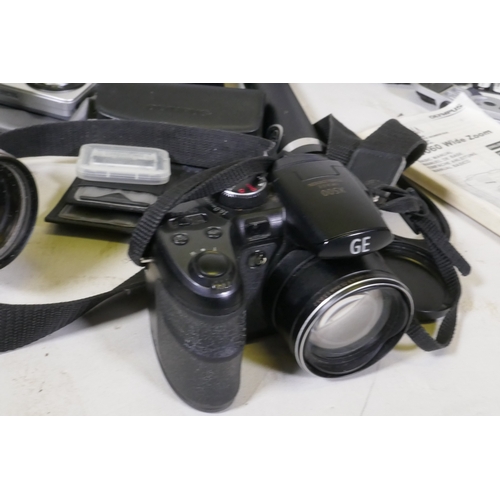 100 - Digital cameras, Panasonic TZ10; Panasonic TZ5; Olympus C5060 wide zoom; GE X500 Aberg Rest; Fuji Fi... 