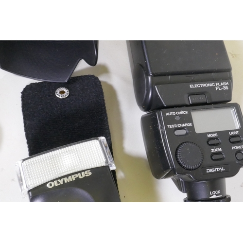 101 - Olympus E500 digital camera with flash units and battery pack