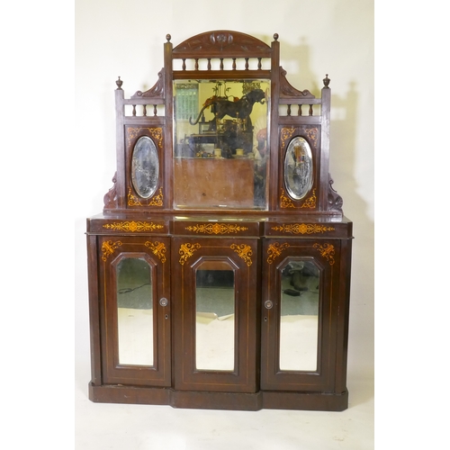 1018 - A Victorian walnut mirror backed chiffonier with breakfront base and three glazed doors, 115 x 30 x ... 