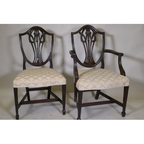 1040 - A set of eight (six plus two) Hepplewhite style shield back chairs, with over stuffed serpentine fro... 