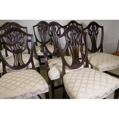 1040 - A set of eight (six plus two) Hepplewhite style shield back chairs, with over stuffed serpentine fro... 