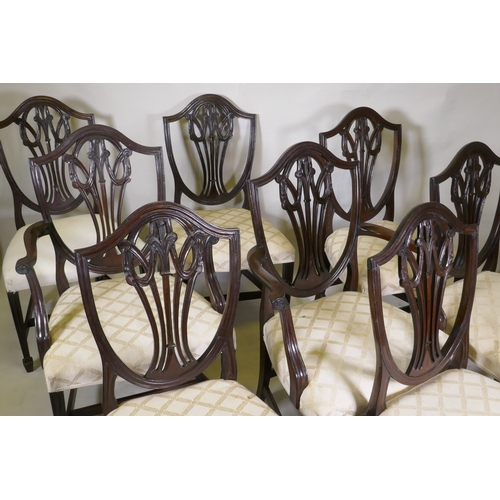 1040 - A set of eight (six plus two) Hepplewhite style shield back chairs, with over stuffed serpentine fro... 