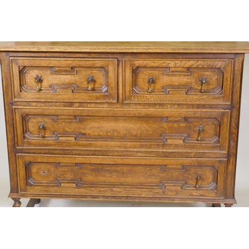 1041 - An early C20th oak Jacobean style dressing table, with swing mirror supported by barley twist column... 