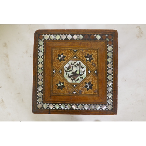 1052 - An antique Islamic occasional table with marquetry and mother of pearl inlaid decoration, with Islam... 