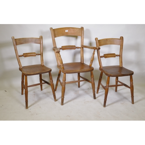 1060 - A C19th Oxford bar back elbow chair and two standards, all with elm seats