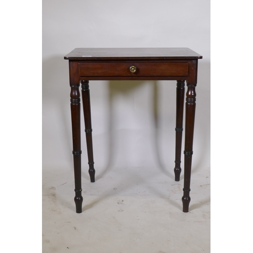 1064 - A Georgian mahogany single drawer side table, raised on ring turned tapering supports