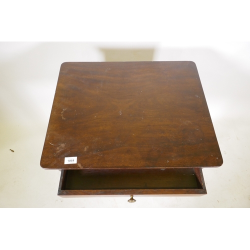 1064 - A Georgian mahogany single drawer side table, raised on ring turned tapering supports