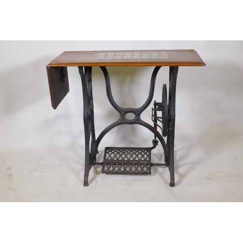 1066 - A Victorian cast iron sewing machine table, with later tiled top, 86 x 41 x 74cm