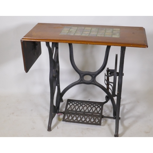 1066 - A Victorian cast iron sewing machine table, with later tiled top, 86 x 41 x 74cm