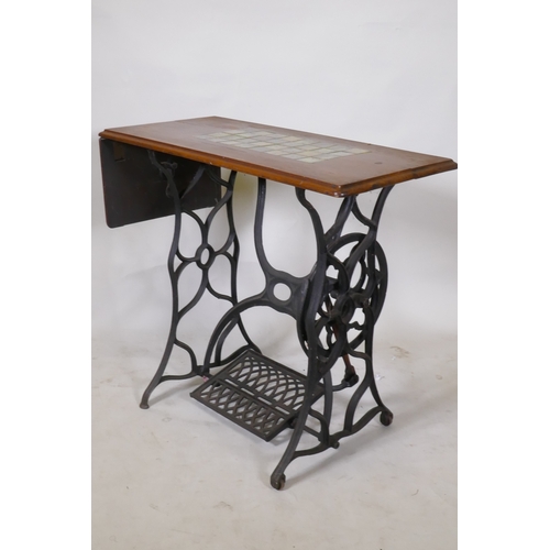 1066 - A Victorian cast iron sewing machine table, with later tiled top, 86 x 41 x 74cm