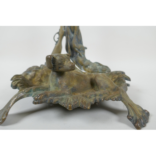 1067 - An antique French brass stick stand with game hunting decoration, 56cm high