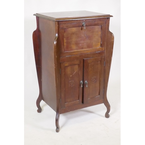 1070 - An early C20th Art Nouveau style mahogany music cabinet, with fall front and two cupboards, 55 x 44 ... 