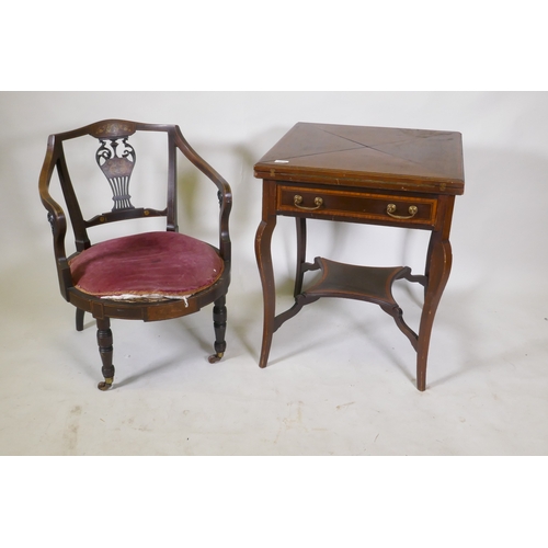 1073 - A Victorian inlaid mahogany envelope card table with single drawer, raised on shaped supports united... 