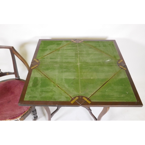 1073 - A Victorian inlaid mahogany envelope card table with single drawer, raised on shaped supports united... 