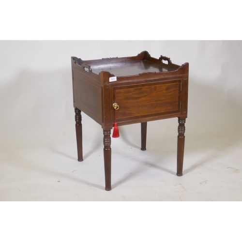 1077 - A Georgian mahogany pot cupboard, with carved galleried top, single door, raised on turned supports,... 