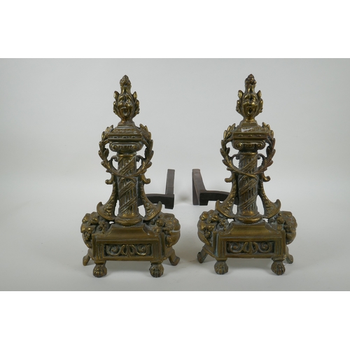 1085 - A pair of antique brass andirons with column and cornucopia decoration, 34cm high