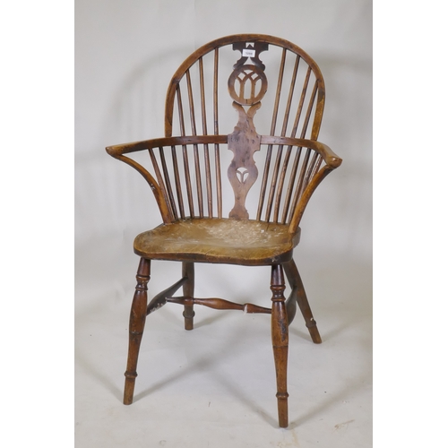 1088 - A C19th yew wood hoop back elbow chair with pierced splat and elm seat, back legs and stretchers, AF