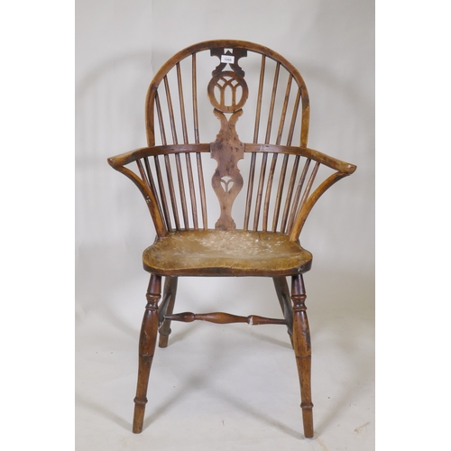 1088 - A C19th yew wood hoop back elbow chair with pierced splat and elm seat, back legs and stretchers, AF