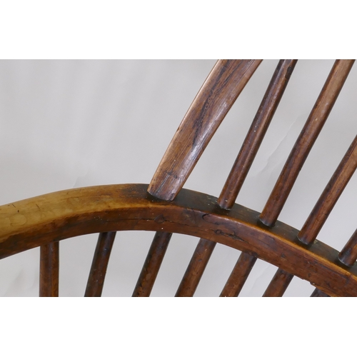 1088 - A C19th yew wood hoop back elbow chair with pierced splat and elm seat, back legs and stretchers, AF