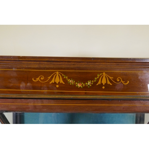 1089 - An Edwardian inlaid mahogany display cabinet with painted decoration and single glazed door, raised ... 